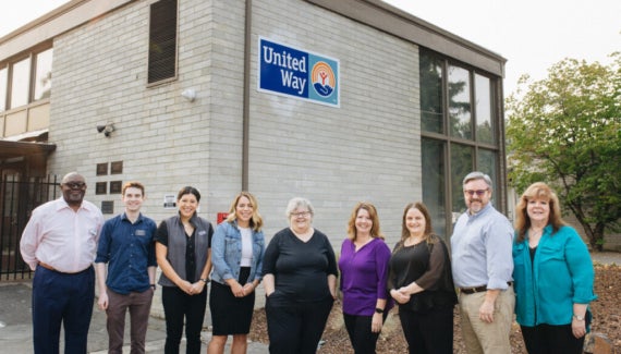 United Way of Jackson County staff stand outside their new building.
