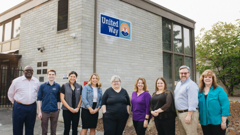 United Way of Jackson County staff stand outside their new building.